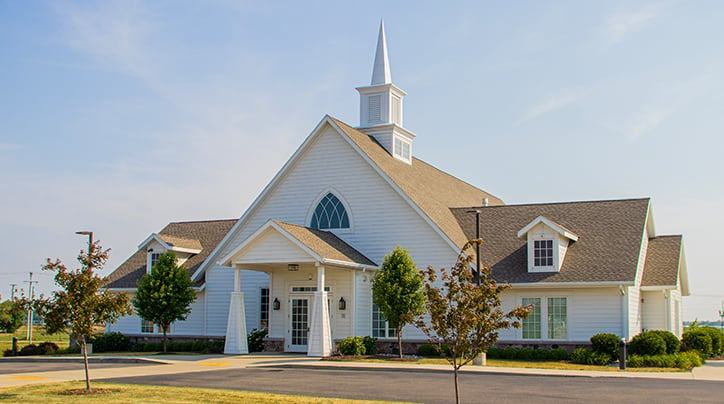 An exterior view of a small, modern Christian church - a religious construction project designed and built by Scherrer Construction in Wisconsin, USA.